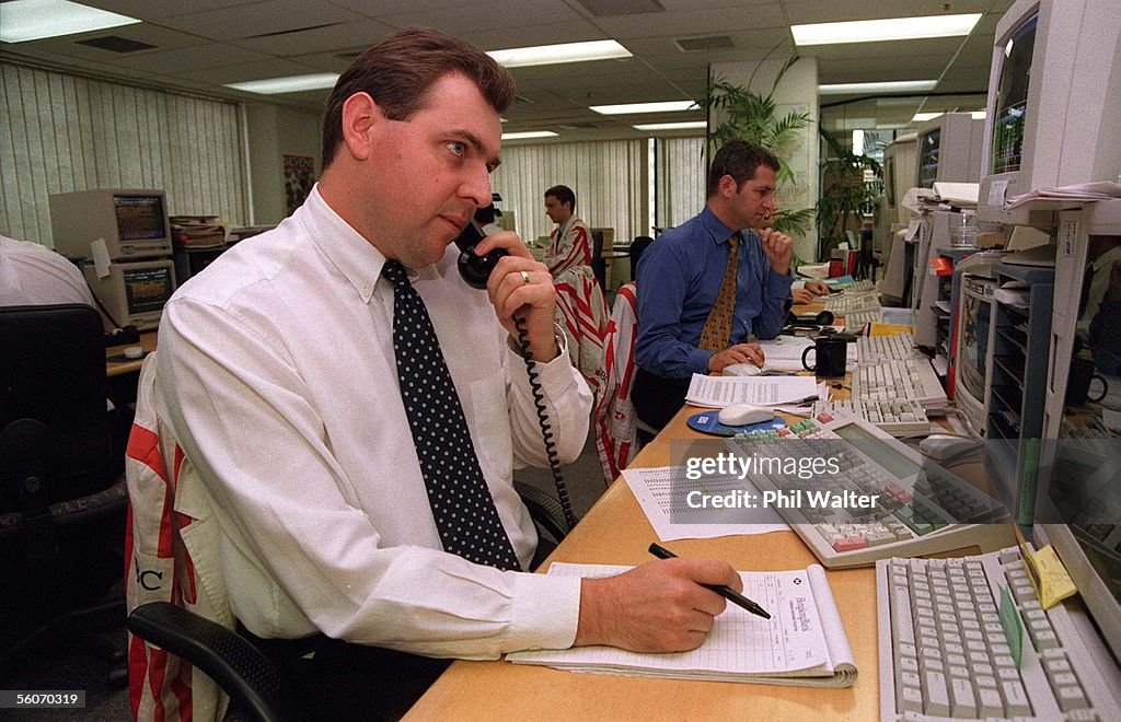 David Irons on the phone on the stock exchange tra