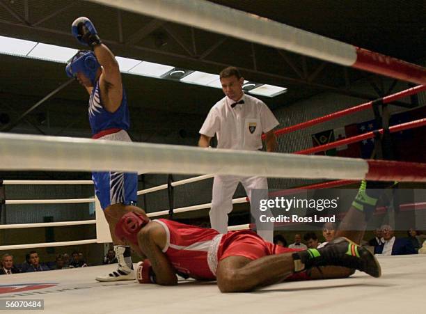 New Zealand Olympic boxer Garth Da Silva has his hands raised as he walks away following the first of two knockdowns in his 91kg bout against Fijian...