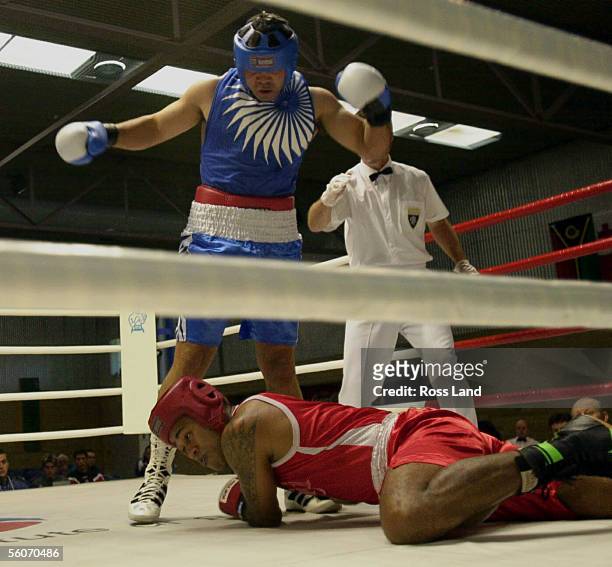 New Zealand Olympic boxer Garth Da Silva watches his opponent fall to the canvas in the first of two knockdowns in his 91kg bout against Fijian Paula...