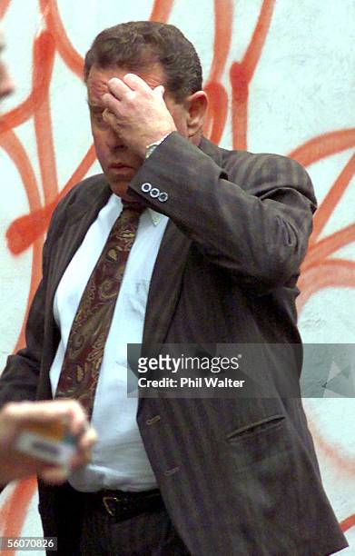 Desmond John Millward runs into a cafe trying to hide from the photographer near the Auckland District Court where he is facing charges of...