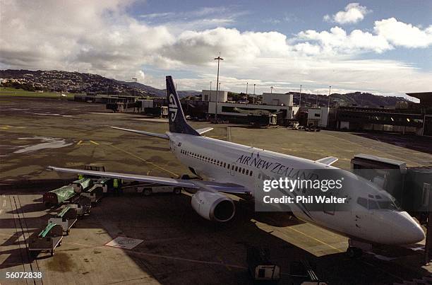 Air New Zealand aircraft is loaded up with luggage on the tarmac at the Wellington airport.