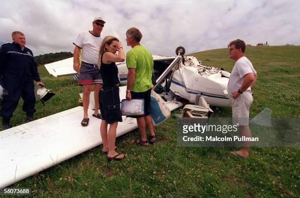 Rescuers gather at the wreckage of a Cessna 182RG aircraft which crashed while attempting to land on a farmers airstrip at Matapouri in Northland....