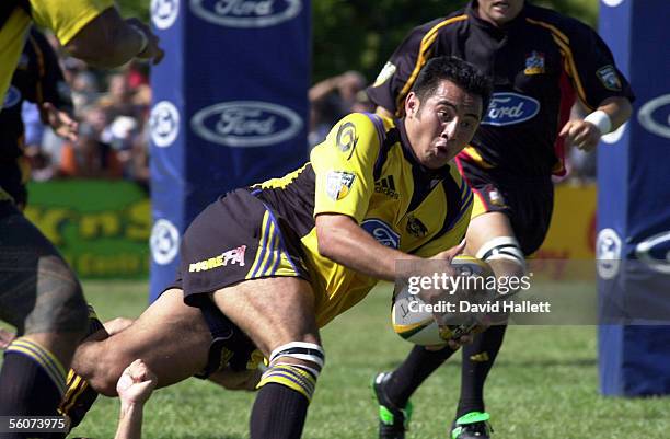 Hurricanes second five eight Mepi Faoagali struggles to get the pass away during their pre season Super 12 rugby game against the Chiefs, Saturday.