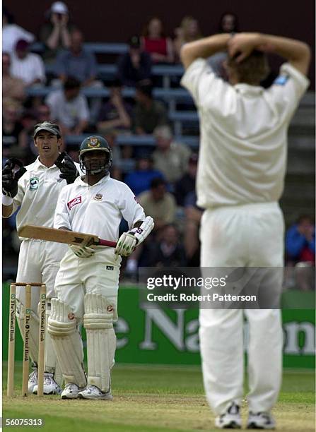 Aminul Islam watches as Daniel Vettori and Adam Parore can only wait as he survives another close call during the Cricket Test in Wellington.