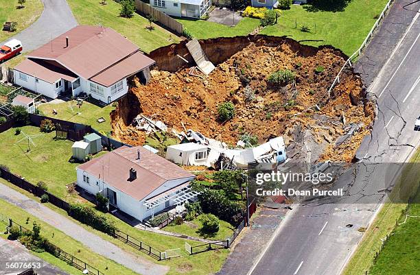 House in Barry Road, near the Martha Gold Mining company offices, collapsed into a huge hole measuring 50 metres wide and 15 metres deep, in the...