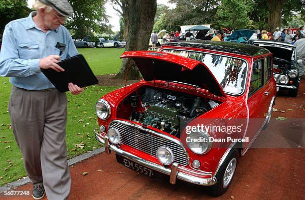 The judges look over this Austin Cooper to find the best car at the Concours d'Elegance Car Show that took place at the Ellerslie Racecourse, Sunday....