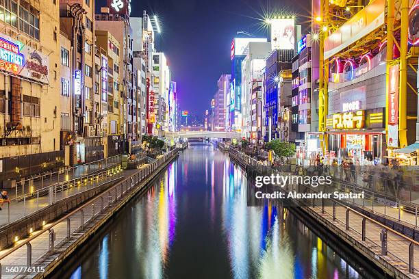 dotonbori canal at night, osaka, japan - osaka stock pictures, royalty-free photos & images