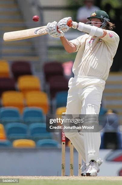 Nathan Bracken of Australia hits out during day two of the 1st Test between Australia and the West Indies at the Gabba on November 4, 2005 in...