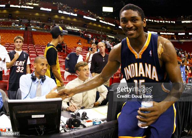 Ron Artest of the Indiana Pacers greets former teammate Reggie Miller after defeating the Miami Heat November 3, 2005 at the American Airlines Arena...