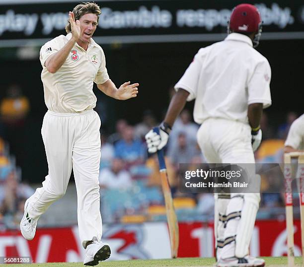 Glenn McGrath of Australia claims the wicket of Marlon Samuels of the West Indies during day two of the First Test between Australia and the West...