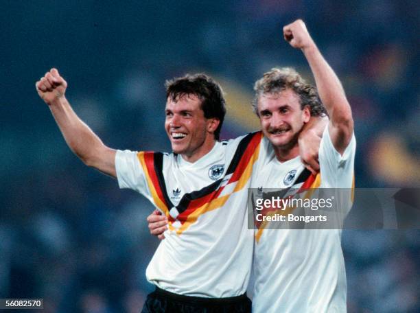 Lothar Matthaeus and Rudi Voeller of Germany celebrate the victory over Argentina in the World Cup final match in the Olympic Stadium on July 8, 1990...