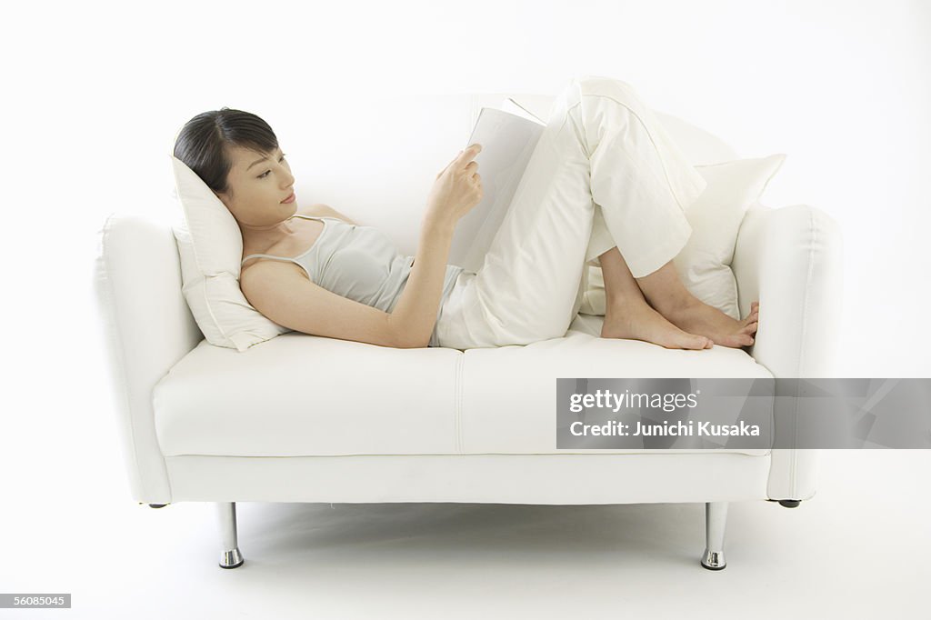 A young woman reading a book