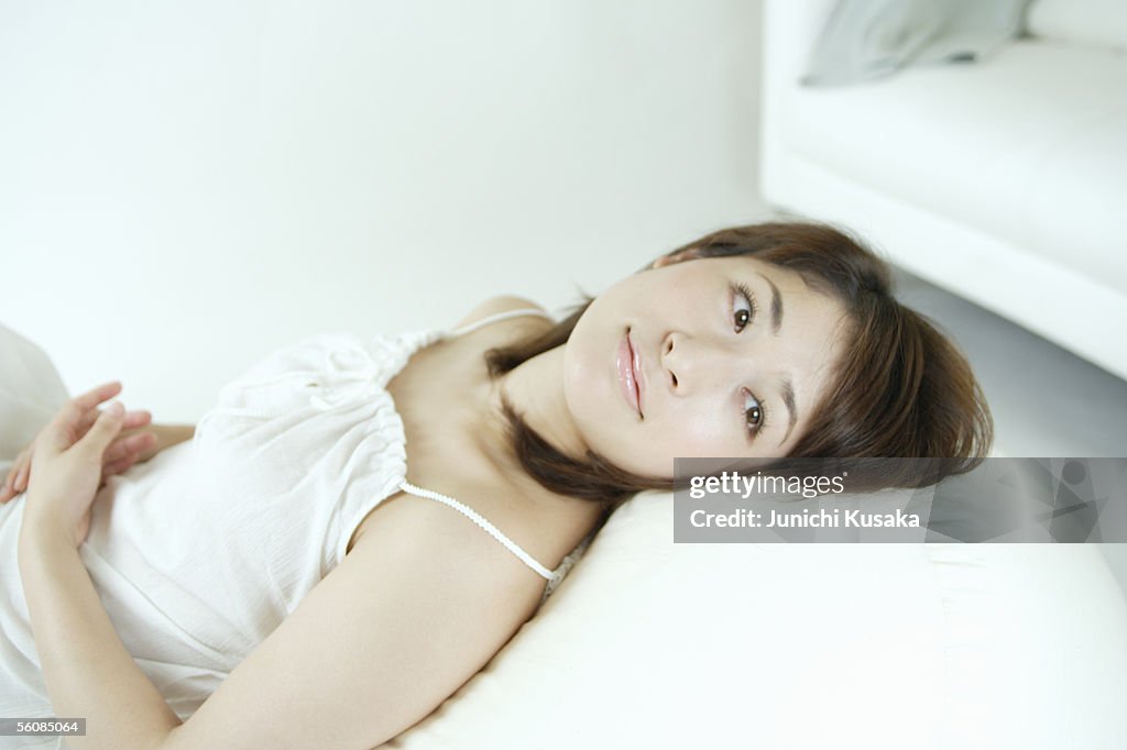 A young woman sitting on a sofa