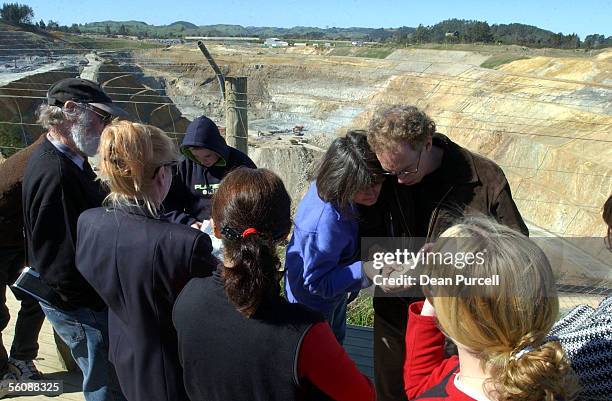 Group of tourists look over the Martha Mine thats located beside the town of Waihi. Local residents of the town have an uncertain future as they have...
