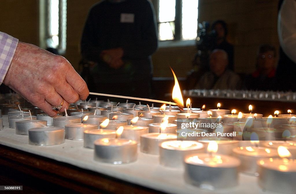 People light candles in remembrance for all those