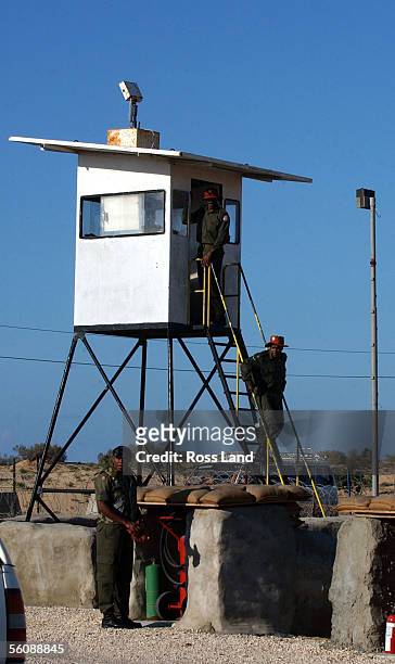 Fijian soldiers of the Multinational Peackeeping Force and Observers, patrol from the tower at camp One Bravo, as New Zealand Prime minister Helen...