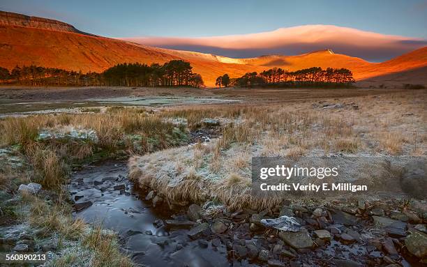 sunrise hits pen-y-fan in the brecon beacons - wales winter stock pictures, royalty-free photos & images