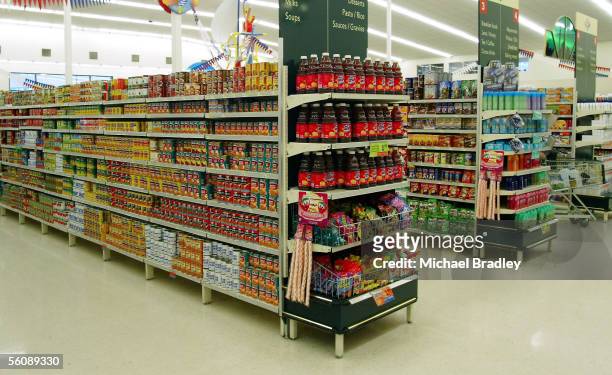 Various canned food and produce on the shelves at a local supermarket.