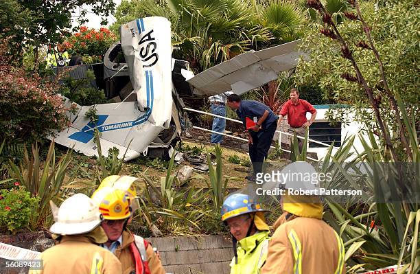 Rescue services attend to a two seater Piper Tomahawk which crashed into a garden in Tennis Court Road, Raumati, Kapiti Coast, at 1pm killing the...