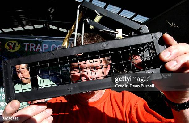 Graeme Goucher with his Ferret Stoat Trap prototype at the 35th New Zealand National Agricultural Fieldays held at Mystery Creek, Wednesday.