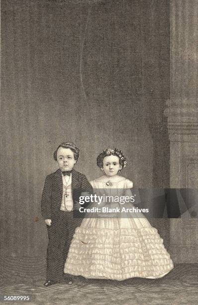 American circus performers George Washington Morrison 'Commodore' Nutt and Minnie Warren pose with their arms linked at the wedding of his rival and...