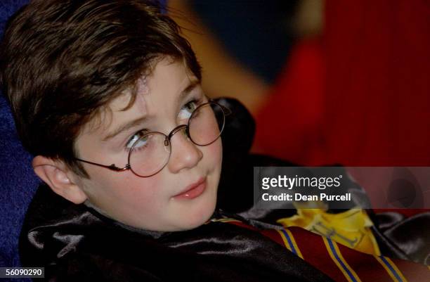 Alexander Marquart age 8 listens to personality's read aloud the new Harry Potter book "Harry Potter and the Order of the Phoenix" at Aotea Centre,...