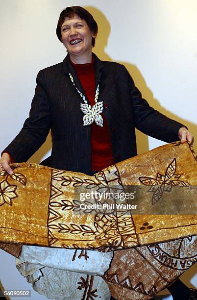 New Zealand Prime Minister Helen Clark with a Tapa cloth presented to her at the launch of the book 'Stars in the Sea'for the upcoming Pacific...