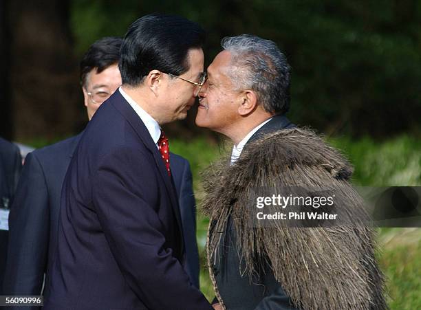 President of the People's Republic of China Hu Jintao and Madame Liu Yongqing follow a traditional challenge from Maori Petty Officer Robert Hewitt...