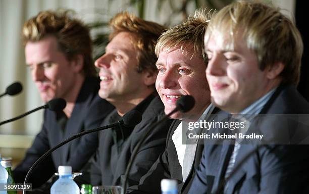 S Pop band Duran Duran lead singer Simon Le Bon speaks as other band members look on, at a press conference ahead of their concert this weekend where...