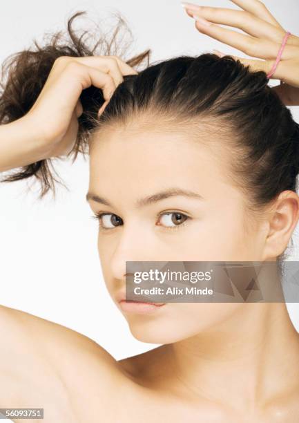400 Woman Putting Hair Up Photos and Premium High Res Pictures - Getty Images 400 Woman Putting Hair Up Photos and Premium High Res Pictures - Getty Images