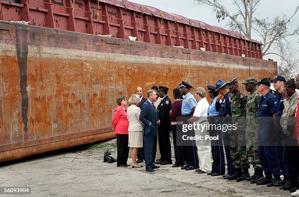 Britain's Prince Charles, Prince of Wales and his wife Camilla, Duchess of Cornwall talk with local dignitaries and emergency personnel including...