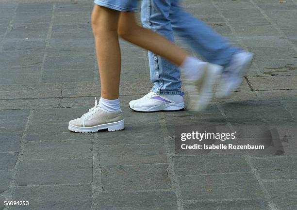 people walking, lower section, blurred motion - stepping stock pictures, royalty-free photos & images