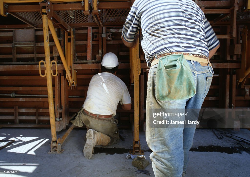 Field Worker Rear View Two Workers In Construction Site Rear View High-Res Stock Photo - Getty ...