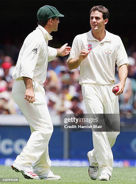 Brendan Nash substitute fieldsman for Australia is consoled by captain Ricky Ponting after dropping a catch during day three of the First Test...