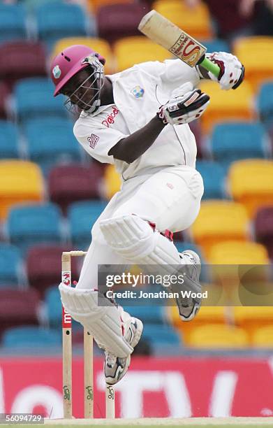 Fidel Edwards of the West Indies attempts to avoid a bouncer during day three of the 1st Test between Australia and the West Indies at the Gabba on...