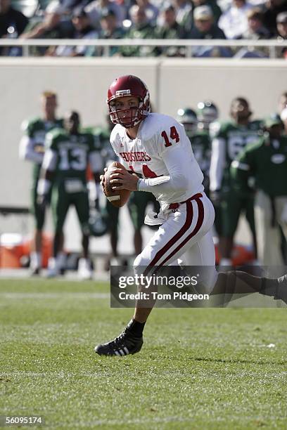 Quarterback Blake Powers of the Indiana Hoosiers rolls out against the Michigan State Spartans at Spartan Stadium on October 29, 2005 in East...