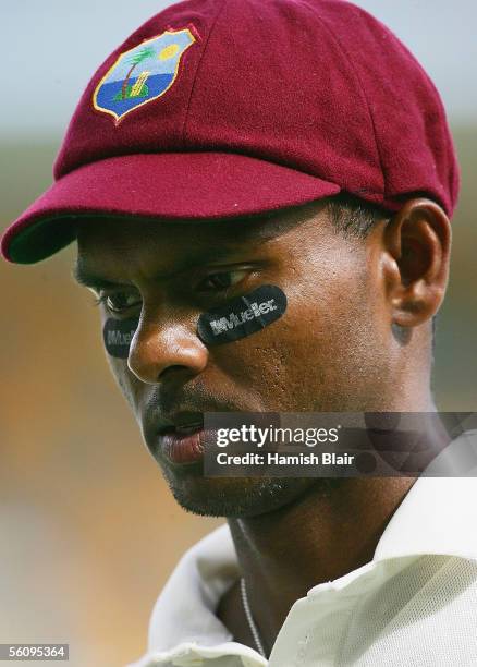 Shivnarine Chanderpaul of the West Indies leaves the field at tea during day three of the First Test between Australia and the West Indies played at...