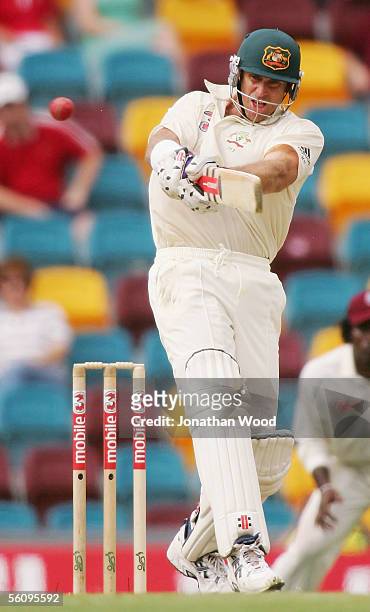 Matthew Hayden of Australia pulls the ball during day three of the 1st Test between Australia and the West Indies at the Gabba on November 5, 2005 in...