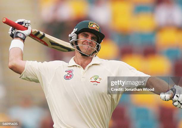 Matthew Hayden of Australia celebrates reaching his century during day three of the 1st Test between Australia and the West Indies at the Gabba on...