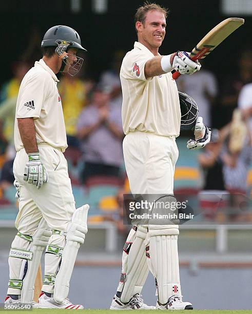 Matthew Hayden of Australia celebrates reaching his century as team mate Ricky Ponting looks on during day three of the First Test between Australia...