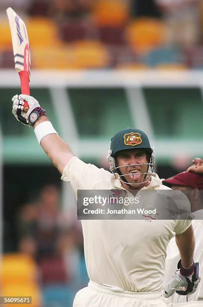 Matthew Hayden of Australia celebrates reaching his century during day three of the 1st Test between Australia and the West Indies at the Gabba on...