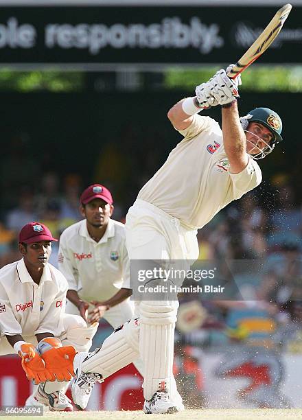 Matthew Hayden of Australia hits a six off the bowling of Chris Gayle of the West Indies during day three of the First Test between Australia and the...