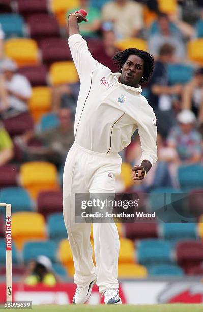 Chris Gayle of the West Indies bowls during day three of the 1st Test between Australia and the West Indies at the Gabba on November 5, 2005 in...