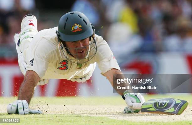 Ricky Ponting of Australia dives for his ground during day three of the First Test between Australia and the West Indies played at the Gabba on...