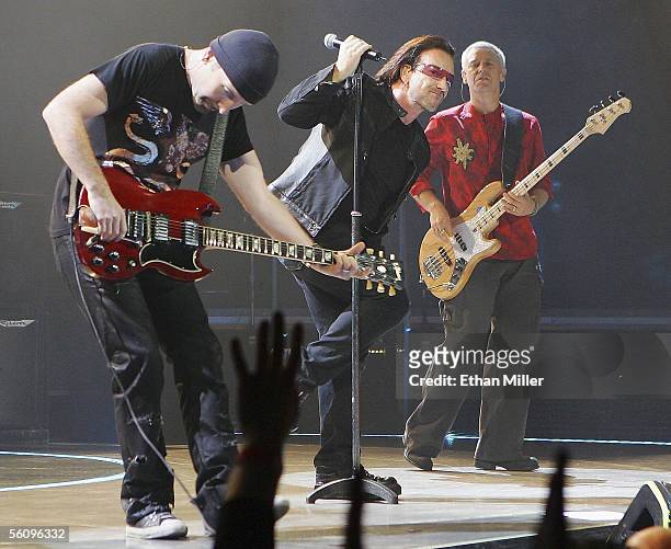 Guitarist The Edge , singer Bono and bassist Adam Clayton perform during the first of two sold-out shows of their "Vertigo" tour at the MGM Grand...