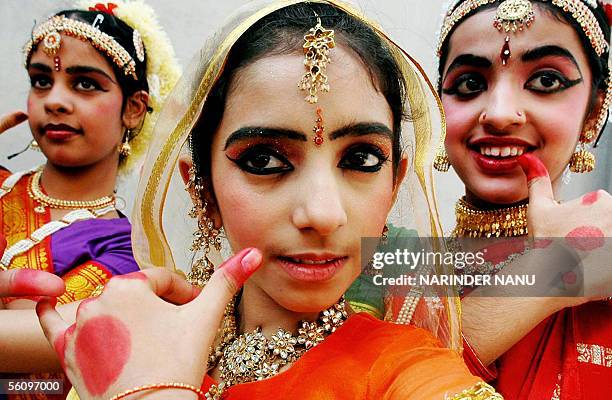 Indian schoolgirls pose as they prepare to perform the classical dance of 'Kaal Beliya" at the BBK DAV College in Amritsar, 05 November 2005. The...