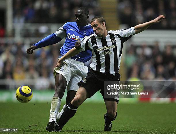 Emile Heskey of Birmingham tackles Lee Clark of Newcastle during the Barclays Premiership match between Newcastle United and Birmingham City at...