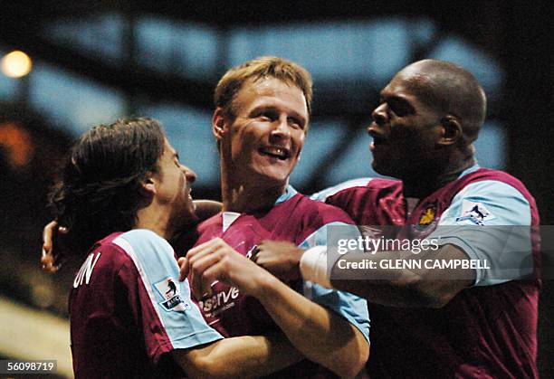 London, UNITED KINGDOM: West Ham United's Teddy Sheringham celebrates with his teammates after scoring the winning goal in the 1-0 win over West...