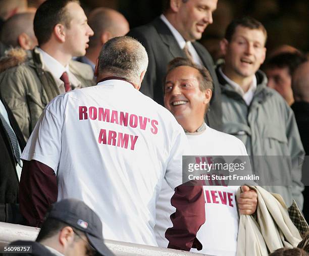 Two Hearts fans support the new owner by wearing t-shirts before the Scottish Premier League match between Heart of Midlothian and Dundee United at...