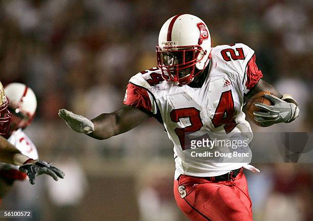 Running back Andre Brown of the North Carolina State Wolfpack looks for room to run against the Florida State Seminoles at Doak Campbell Stadium on...